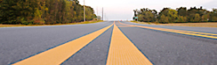 yellow striping on highway pavement