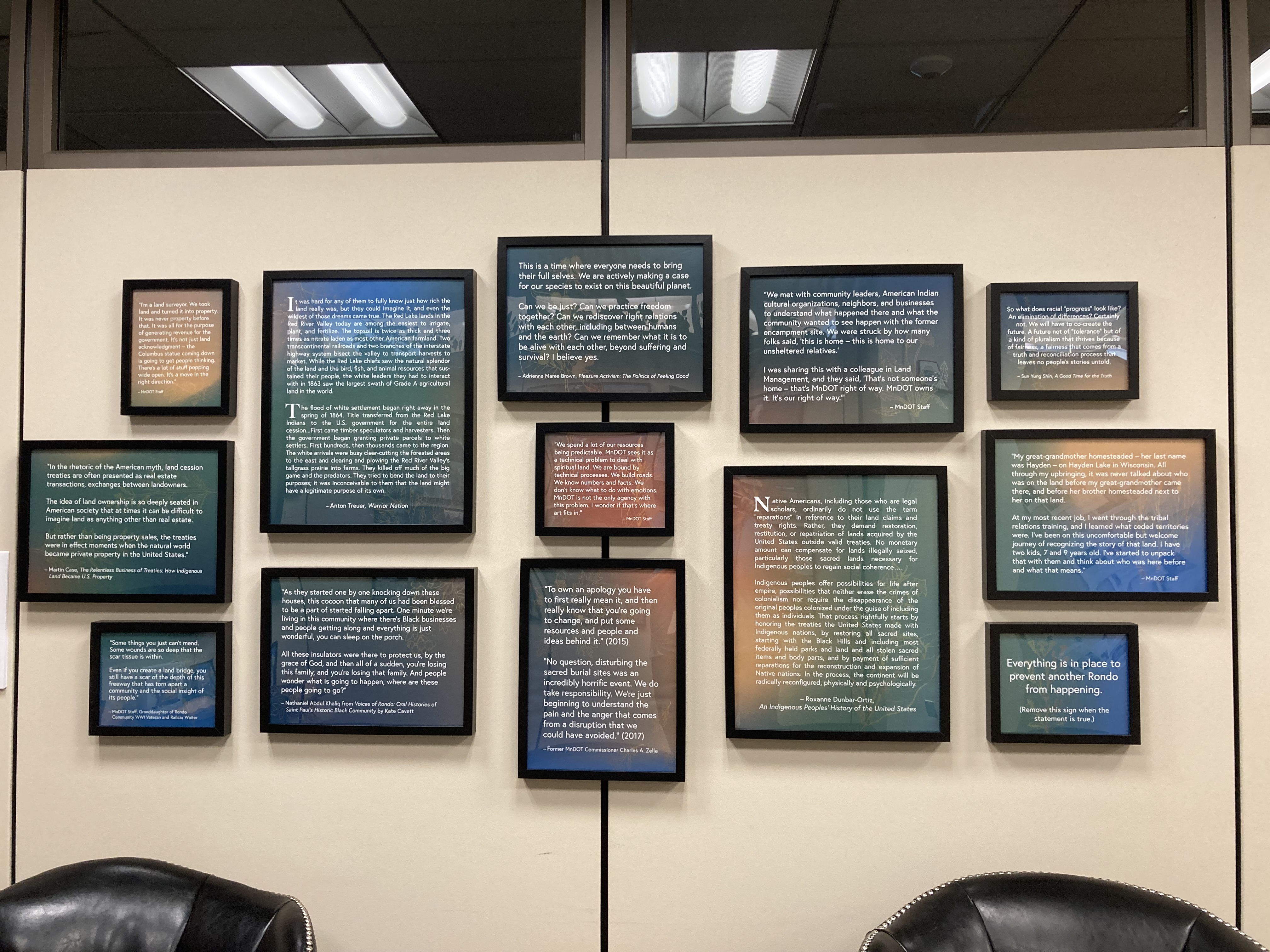 Framed quotes on land and community on the wall of the Land Acknowledgement room